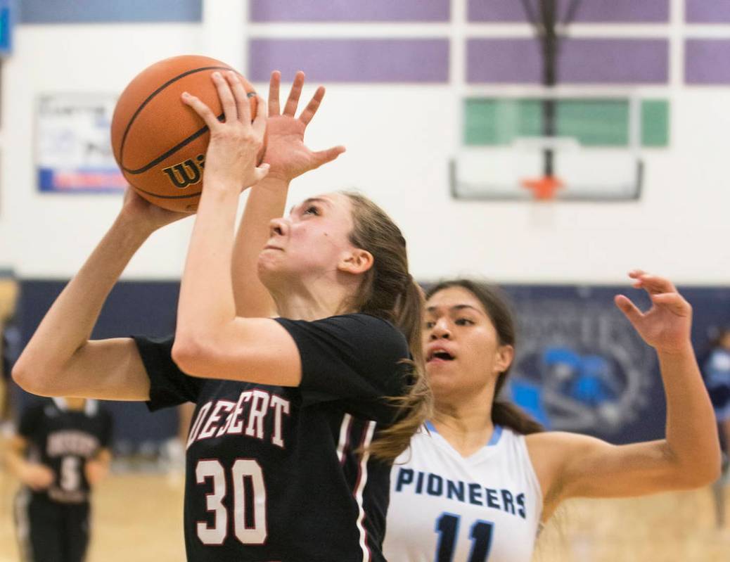 Desert Oasis senior forward Sierra Mich’l (30) drives baseline past Canyon Springs jun ...