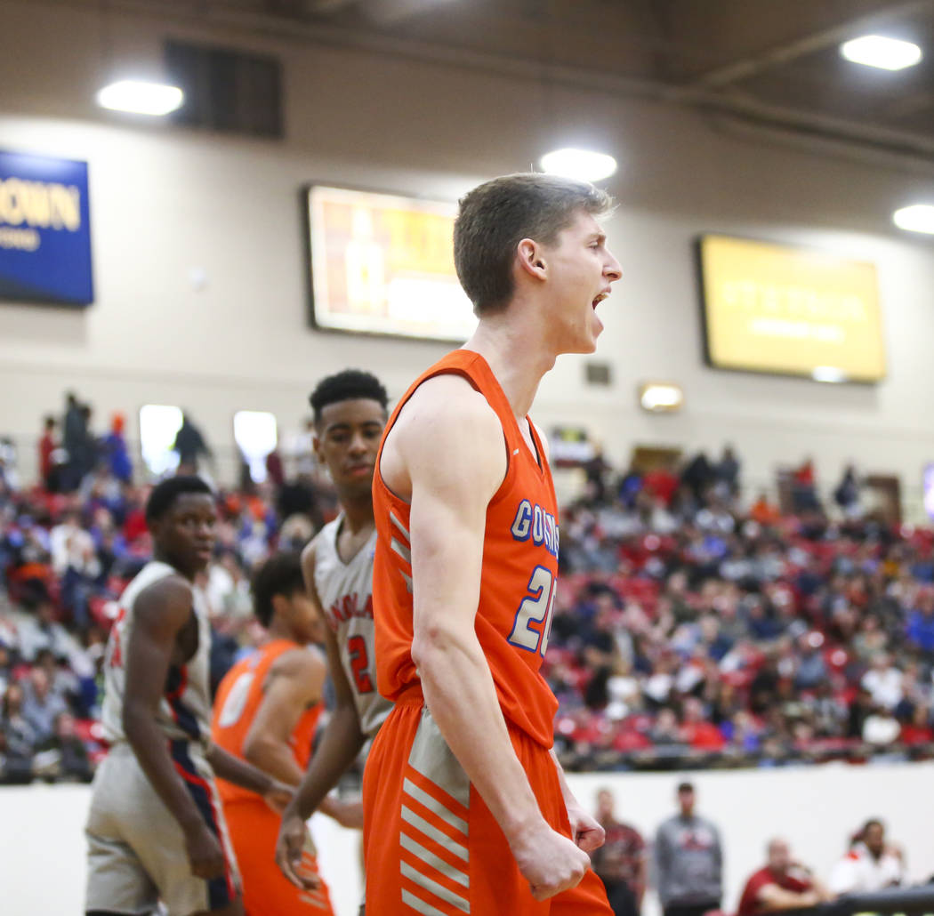 Bishop Gorman’s Noah Taitz celebrates his dunk against Findlay Prep during the first h ...