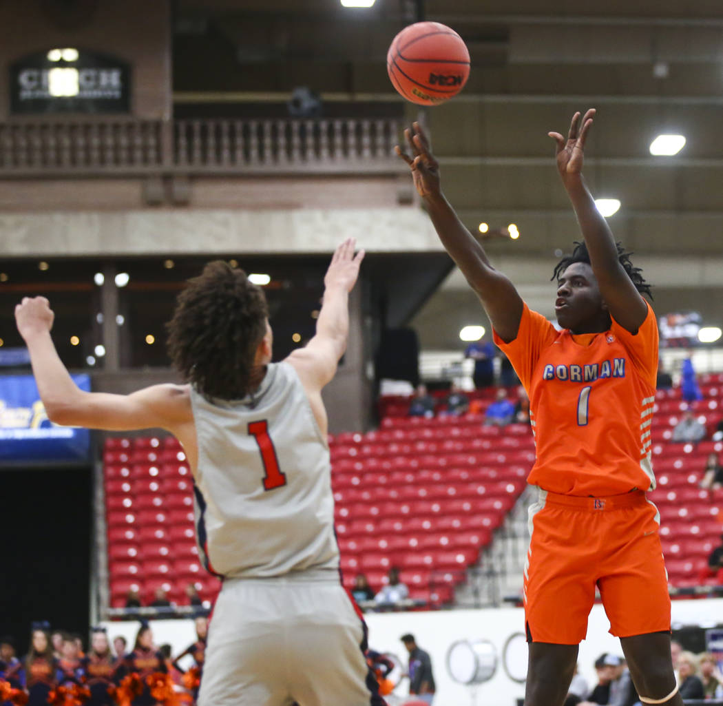 Bishop Gorman’s Will McClendon (1) shoots over Findlay Prep’s Blaise Beauchamp ( ...