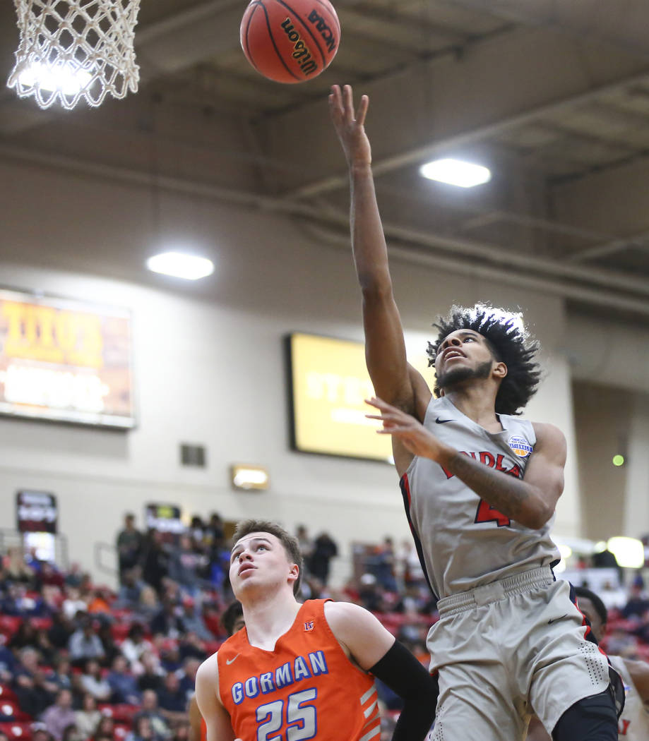 Findlay Prep’s P.J. Fuller goes to the basket against Bishop Gorman’s Chance Mic ...