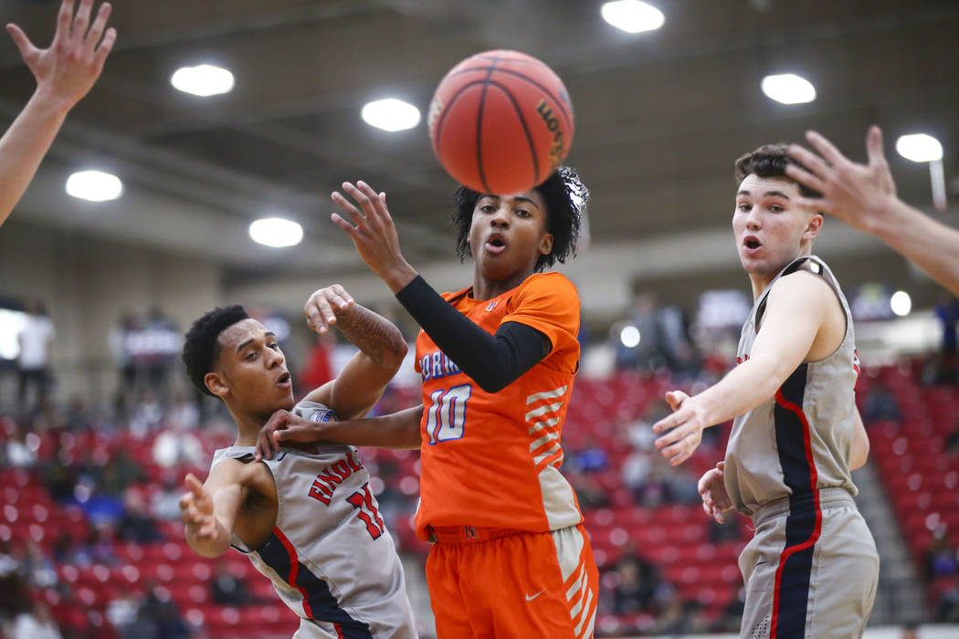 Bishop Gorman’s Zaon Collins (10) watches a loose ball between Findlay Prep’s Ta ...