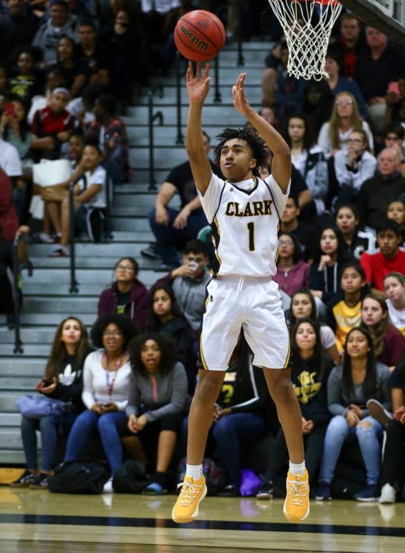 Clark’s Frankie Collins (1) goes up to score a three-pointer against Bishop Gorman dur ...