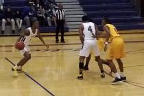 Democracy Prep’s Najeeb Muhammad, left, drives to the basket against Del Sol on Tuesda ...