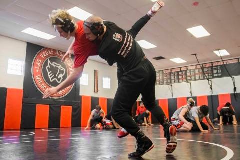 Daniel Law, right, lifts Trace Everett during wrestling practice on Friday, Jan. 25, 2019, a ...