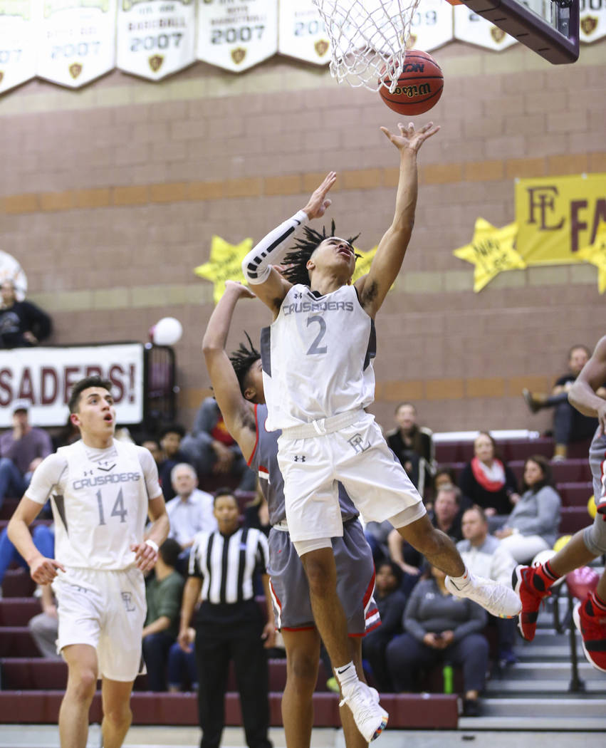 Faith Lutheran’s Donavan Jackson (2) goes to the basket against Arbor View during the ...