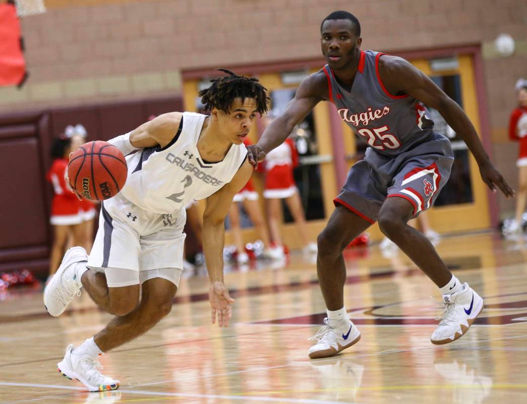 Faith Lutheran’s Donavan Jackson (2) drives the ball against Arbor View’s Larry ...