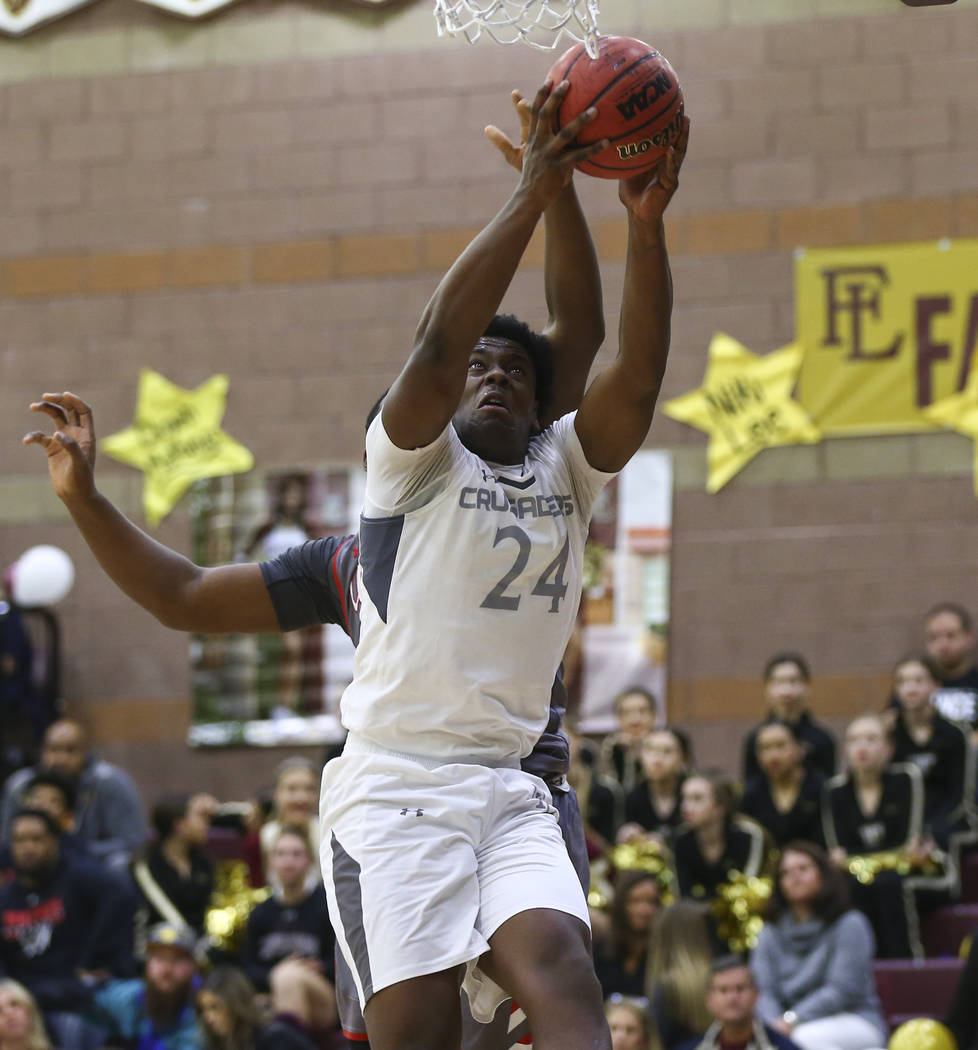 Faith Lutheran’s D.J. Heckard (24) gets a rebound against Arbor View during the first ...