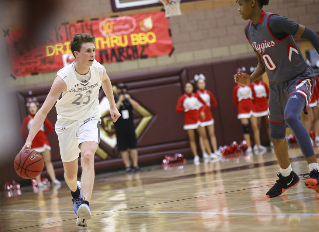 Faith Lutheran’s Brevin Walter (23) brings the ball up court against Arbor View’ ...