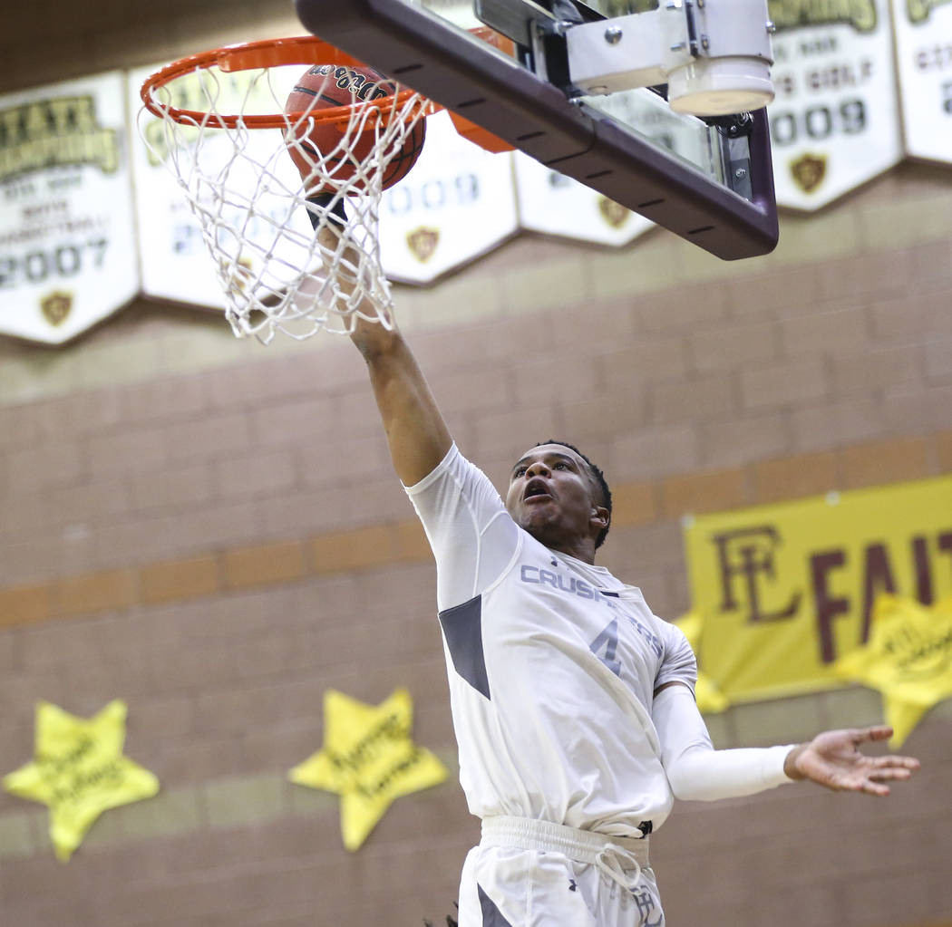 Faith Lutheran’s Sedrick Hammond (4) goes to the basket against Arbor View during the ...