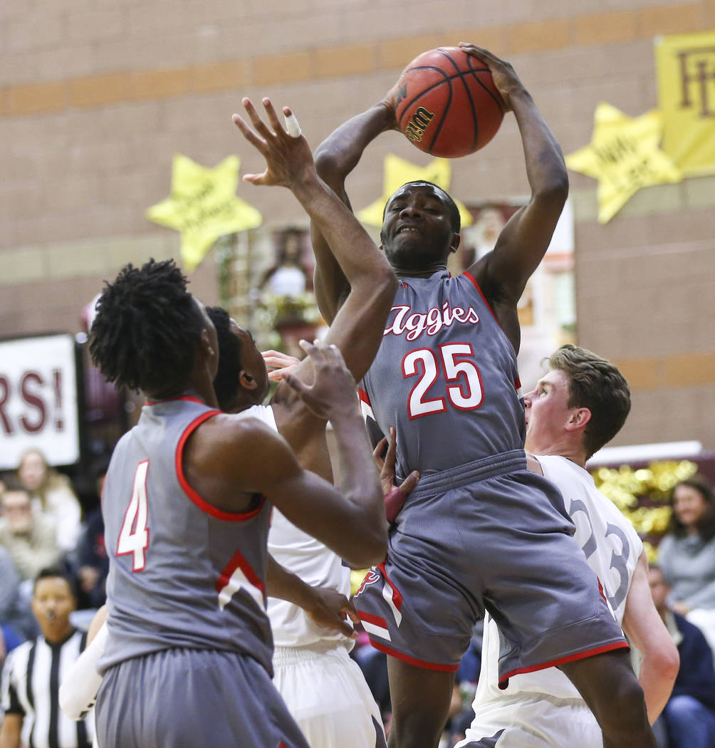 Arbor View’s Larry Holmes (25) gets a rebound during the first half of a basketball ga ...
