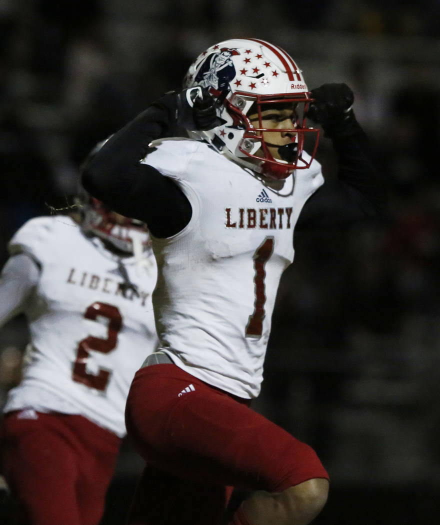 Liberty High’s wide receiver Cervontes White (1) celebrates his touchdown during a gam ...