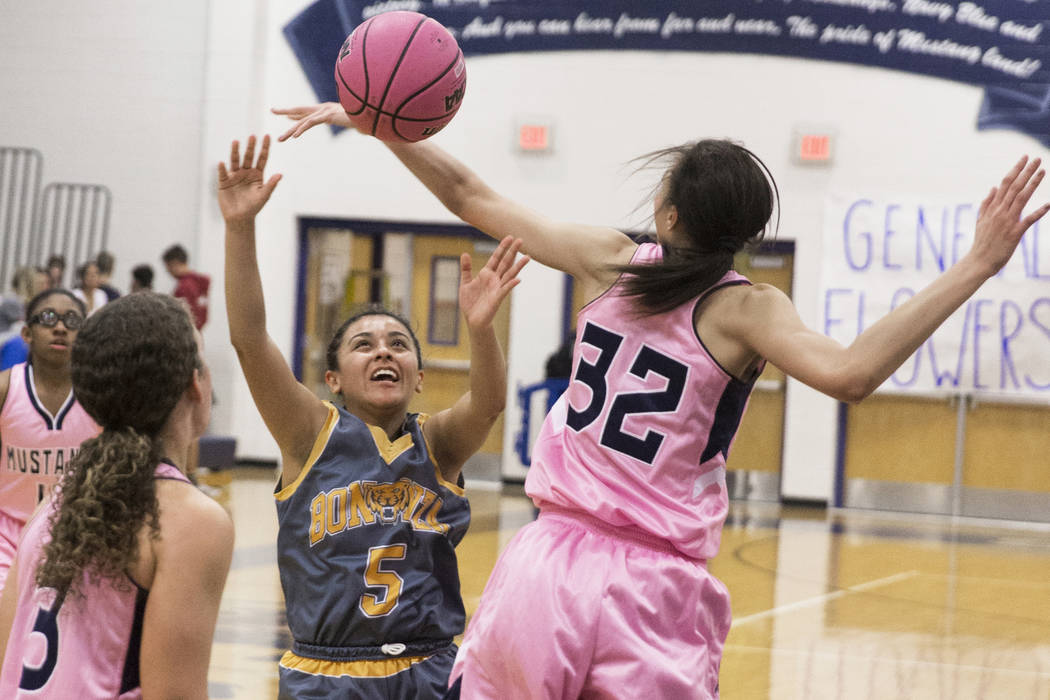 Bonanza sophomore Isaira Diaz (5) fights for a rebound with Shadow Ridge junior Christina Th ...