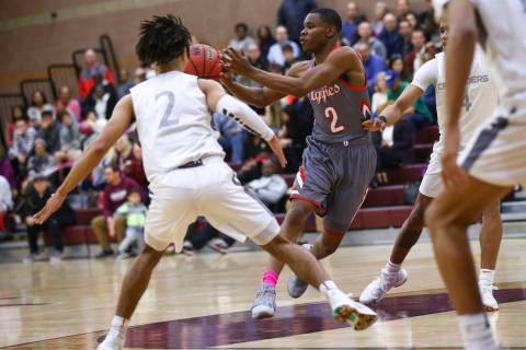 Arbor View’s Favor Chukwukelu (2) passes the ball during the first half of a basketbal ...