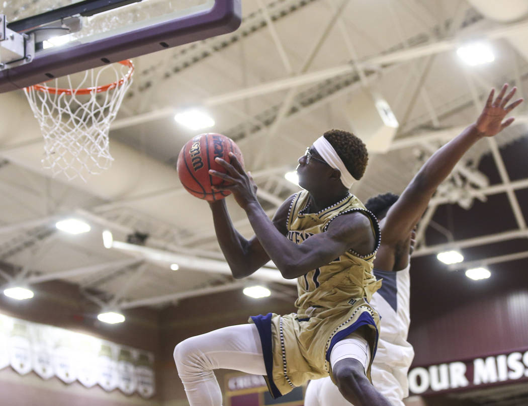 Cheyenne’s Tommie Lindsey (11) goes to the basket during the second half of a basketba ...