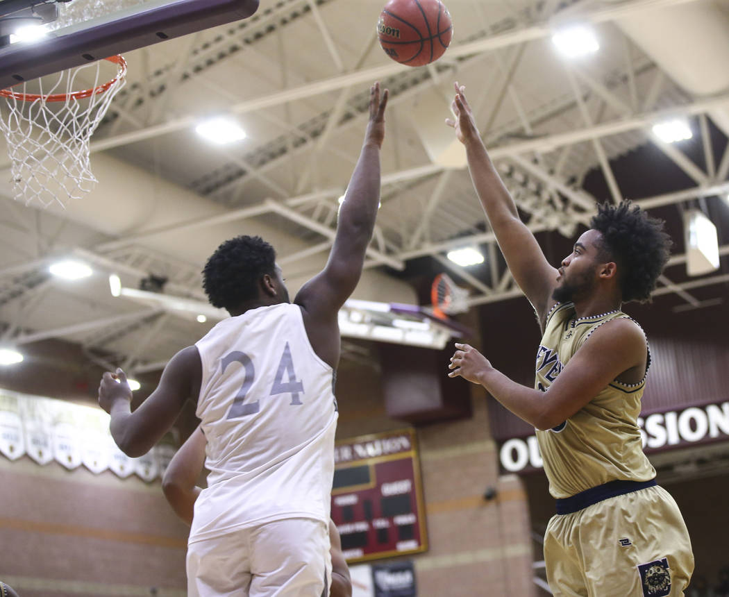 Cheyenne’s Damion Bonty (23) shoots over Faith Lutheran’s D.J. Heckard (24) duri ...