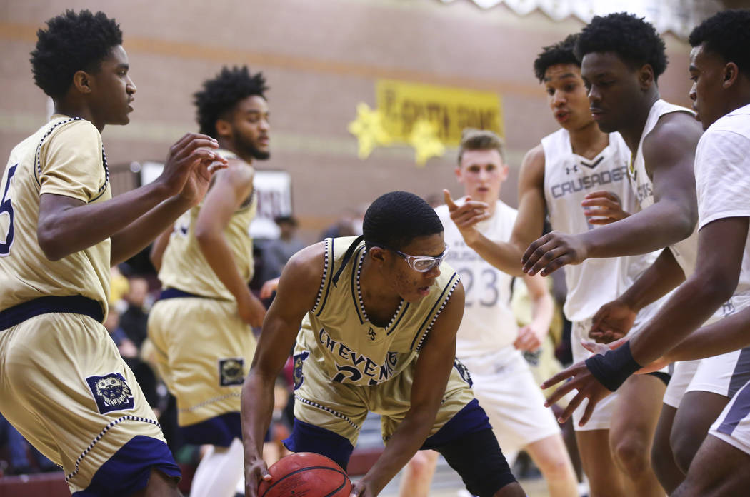 Cheyenne’s Davey Burdette (20) looks to move the ball during the first half of a baske ...