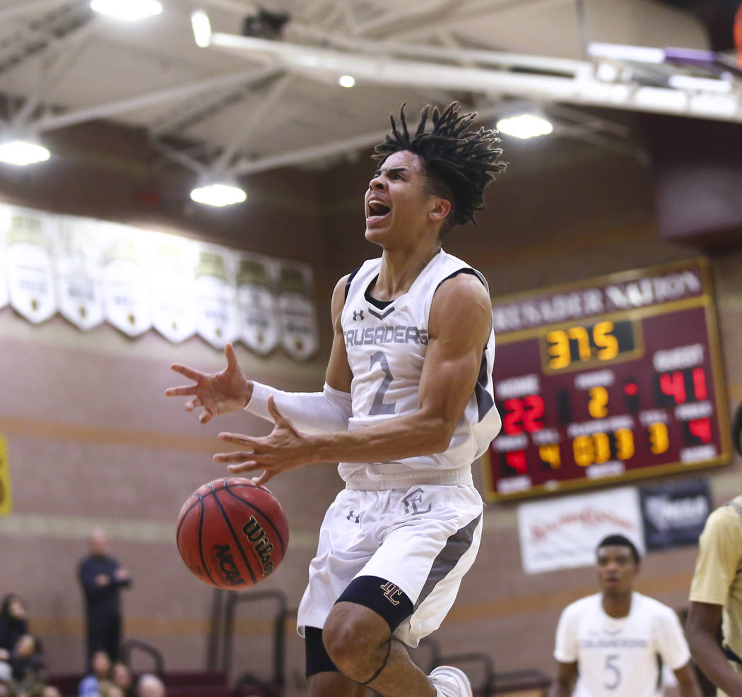 Faith Lutheran’s Donavan Jackson (2) reacts after getting fouled by Cheyenne during th ...