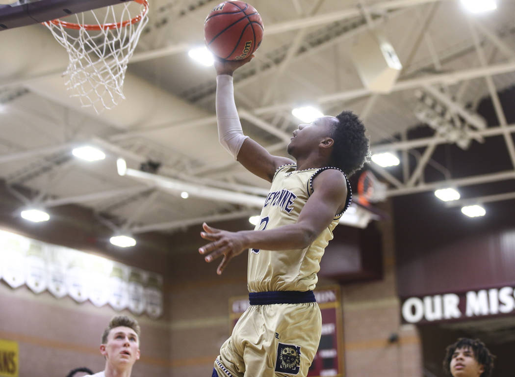 Cheyenne’s J.D. McCormick (3) goes to the basket during the second half of a basketbal ...