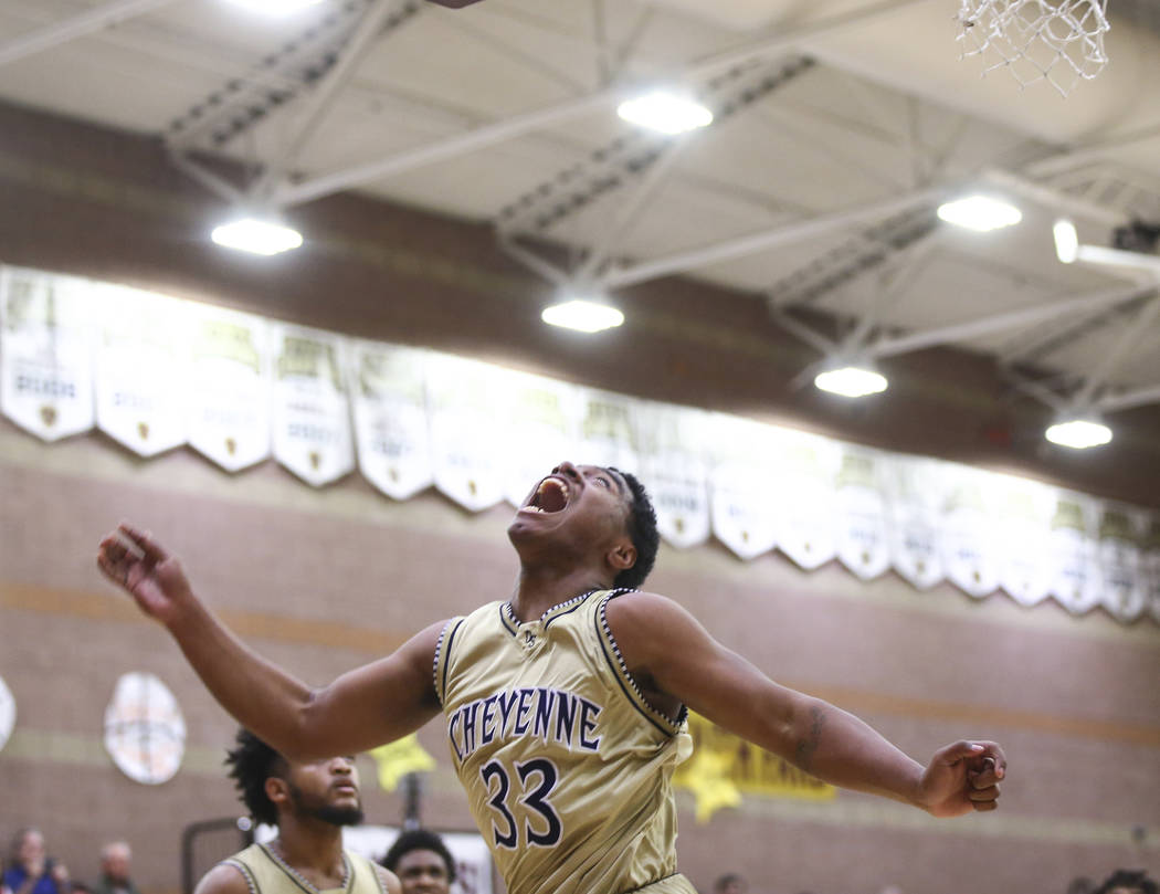 Cheyenne’s Mike Reed (33) watches his shot go in during the second half of a basketbal ...