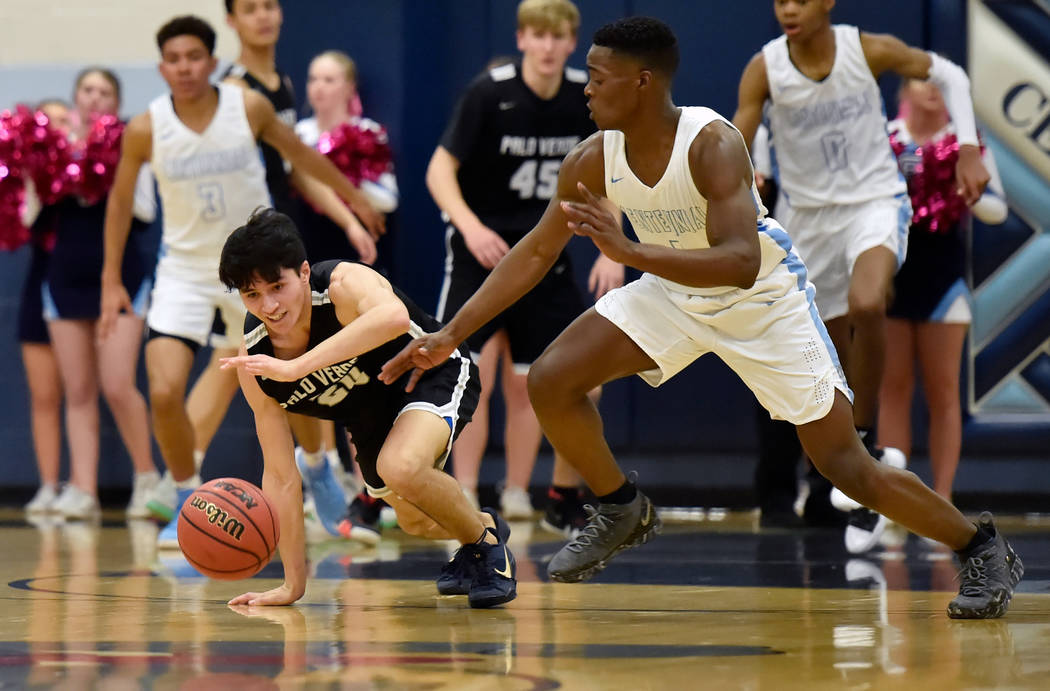 Palo Verde’s Sebastian Bejaoui (20) and Centennial’s Jairus Dickson (1) chase a ...