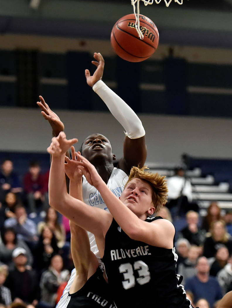 Centennial’s Leland Wallace (15) and Palo Verde’s Sam Johnson (33) reach for a r ...