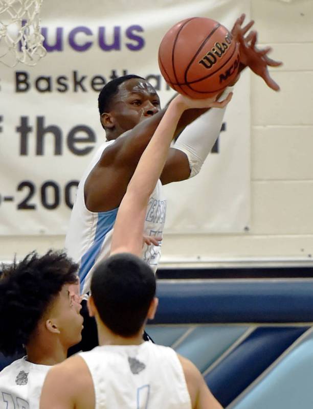 Centennial’s Leland Wallace blocks a shot against Palo Verde during a high school bask ...