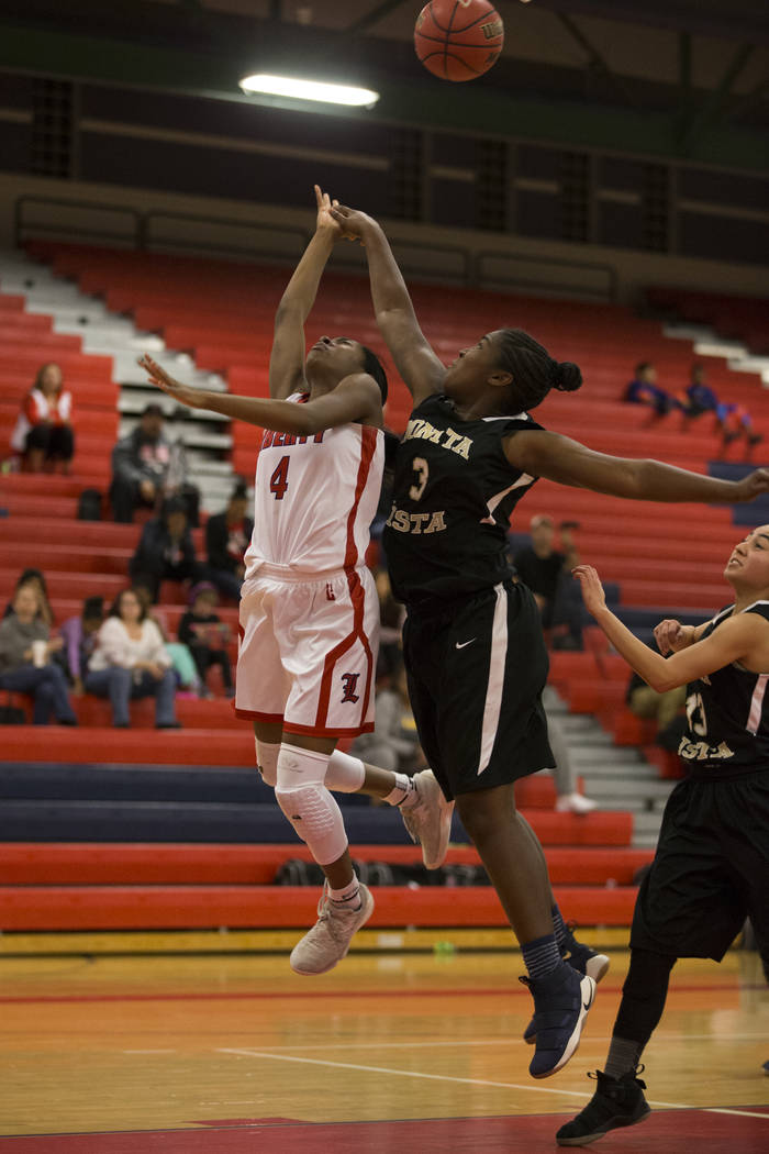 Liberty’s Starr Walker (4) goes up for a shot against Bonita Vista’s Keyanna McC ...