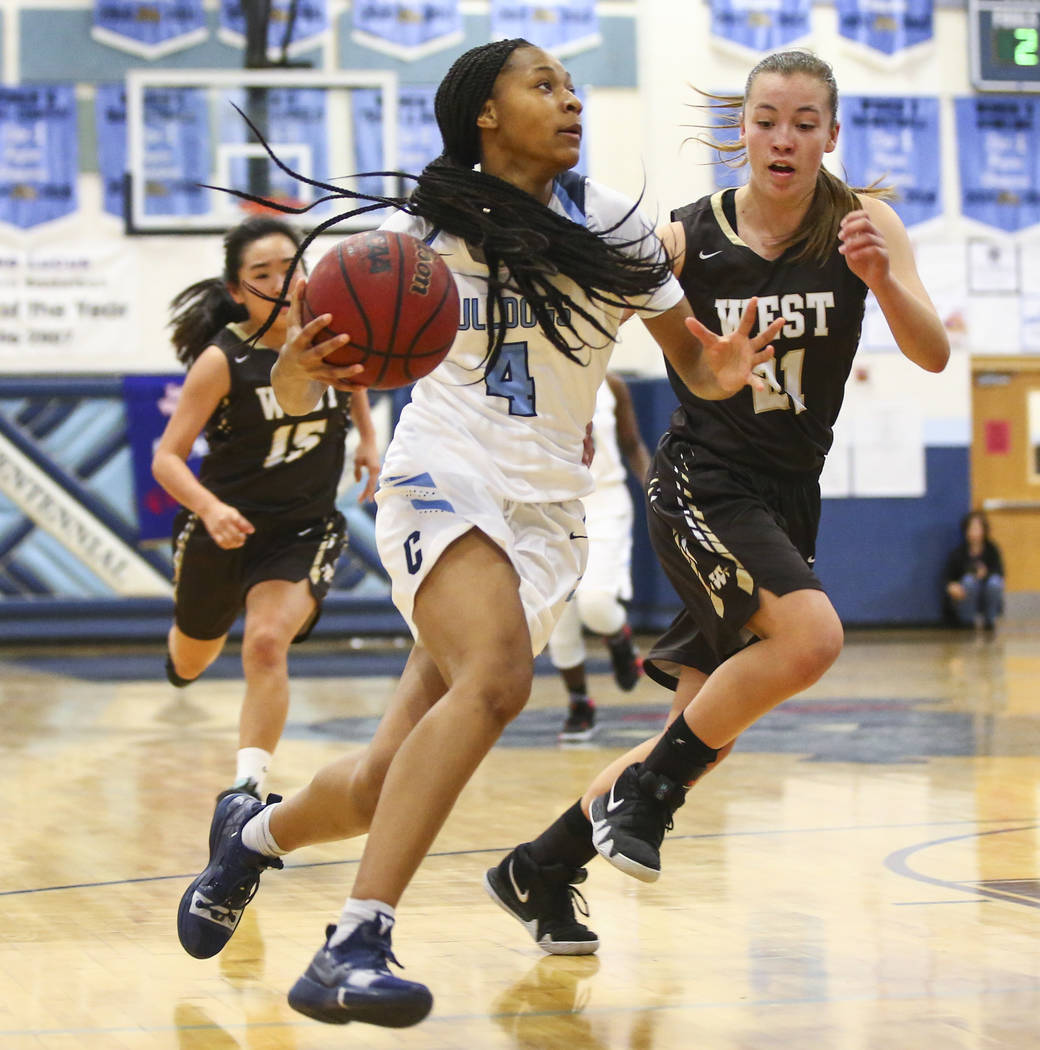 Centennial’s Taylor Bigby (4) drives to the basket against WestÕs Ella Estabrook (21) ...