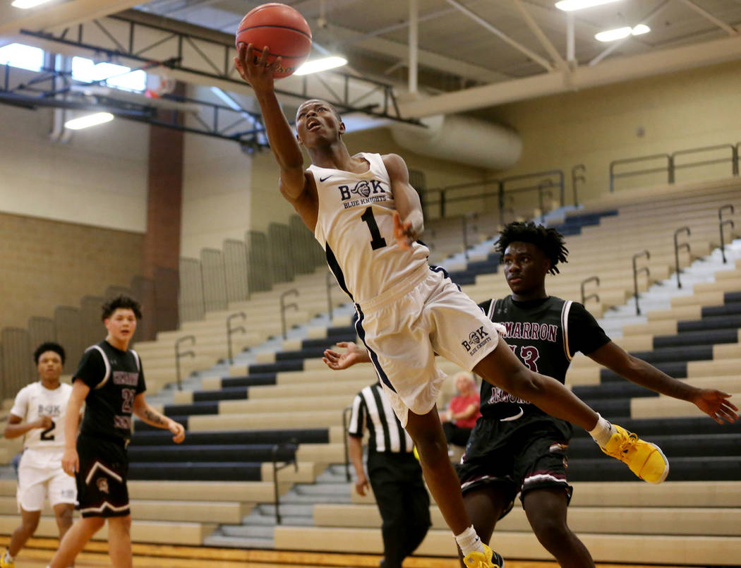 Democracy Prep’s Najeeb Muhammad (1) goes up for a shot against Cimarron-Memorial in t ...