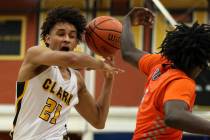Clark’s Jalen Hill (21) runs down the court with the ball during a basketball game at ...