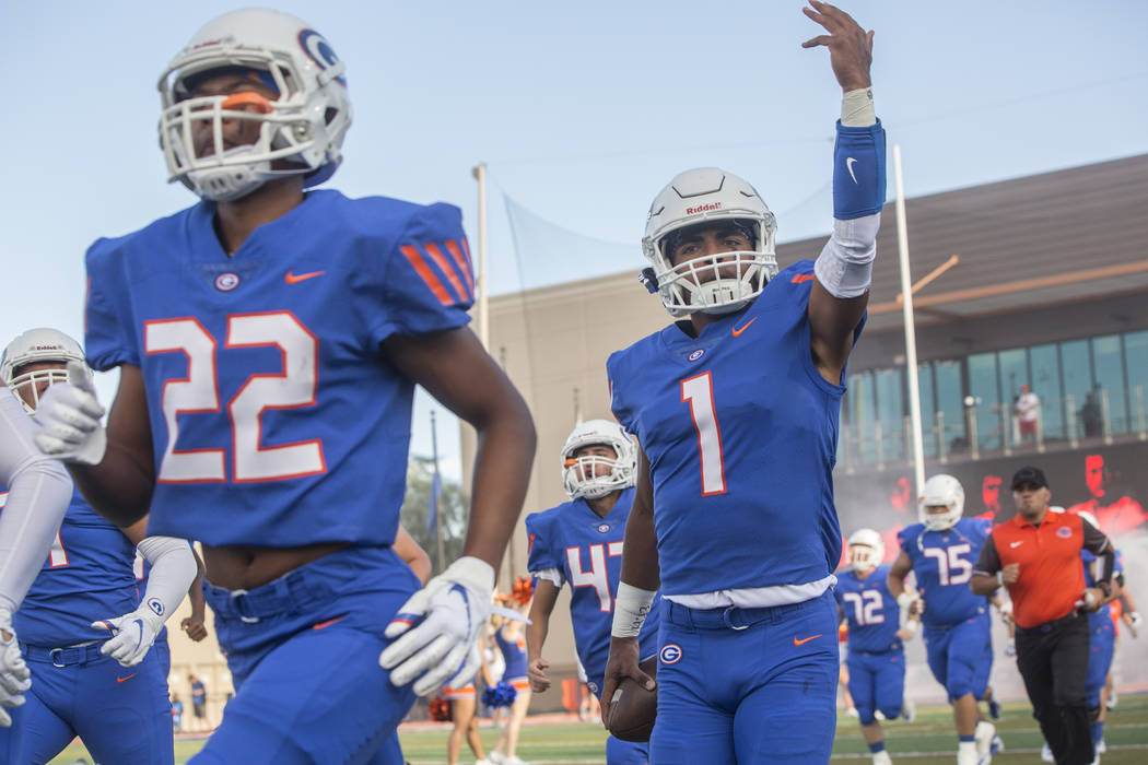 Bishop Gorman junior quarterback Micah Bowens (1) salutes the crowd as the Gaels take the fi ...