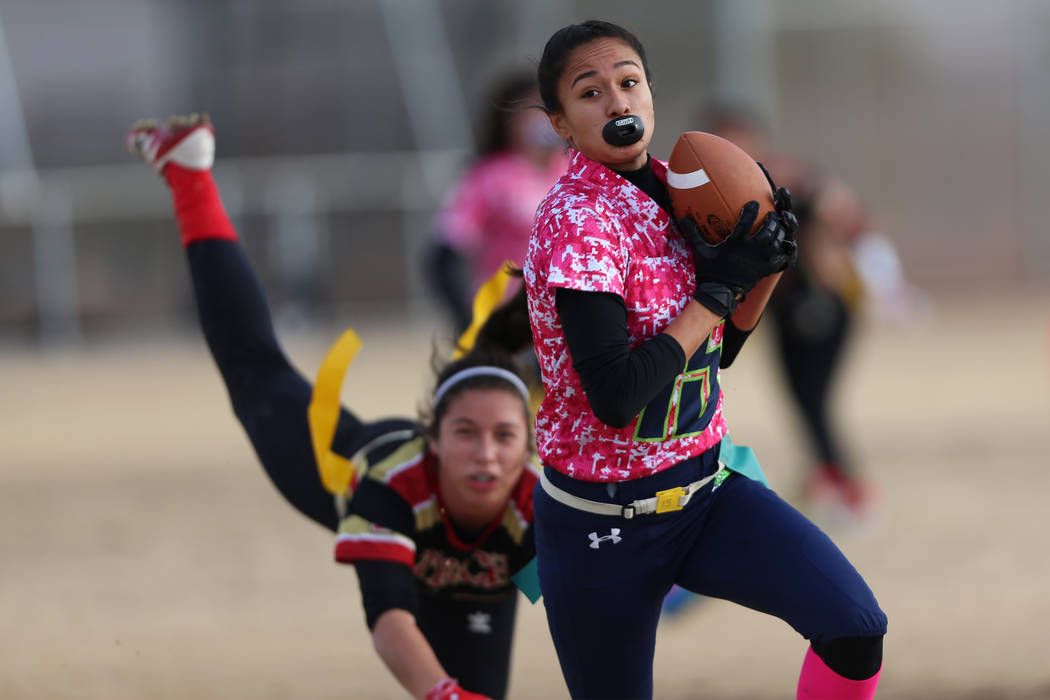 Green Valley junior Jazlyn Camacho (15) makes an interception against SECTA in the flag foot ...