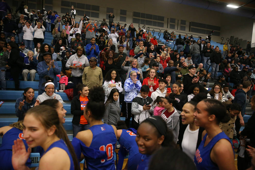 Fans celebrate with Bishop Gorman players after their win against Desert Oasis in the Desert ...