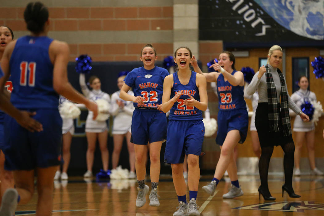 The Bishop Gorman bench reacts after a score by Olivia Smith (11) to beat the buzzer in the ...