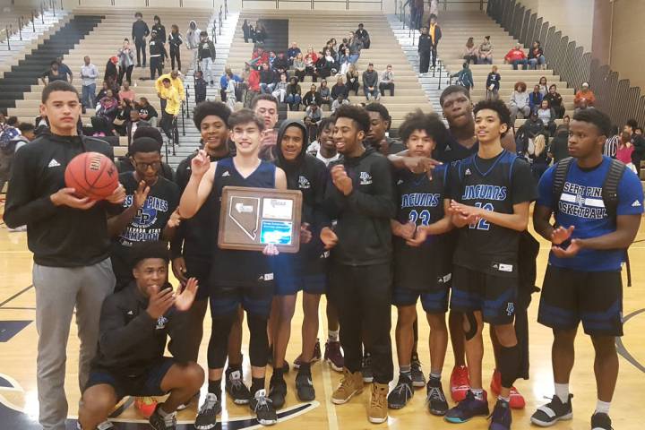 Desert Pines poses with the championship trophy after beating Arbor View 49-46 in the Mounta ...