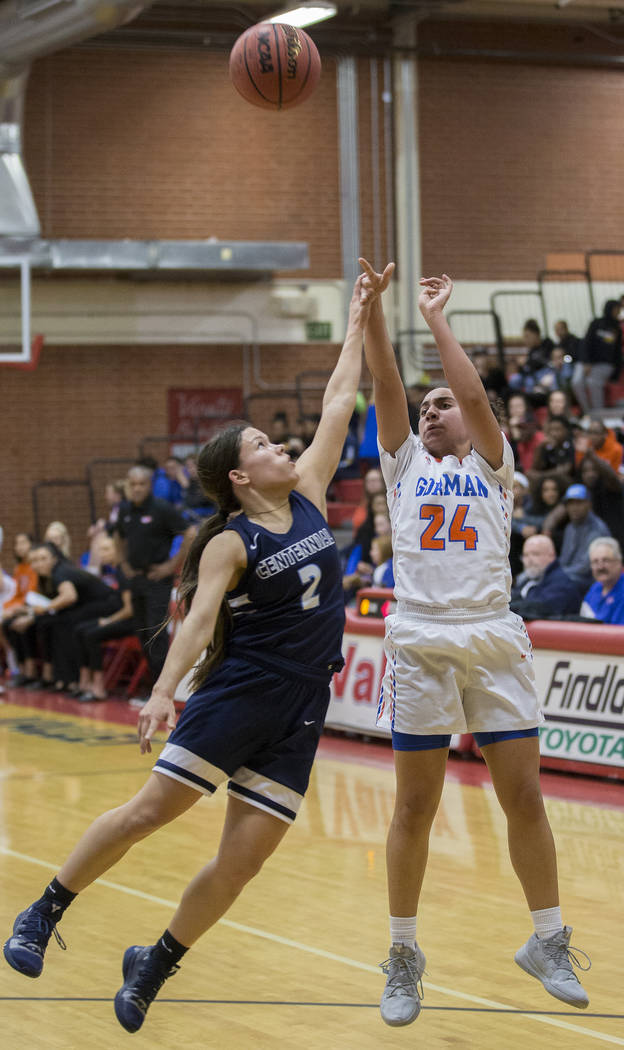 Bishop Gorman junior Bentleigh Hoskins (24) shoots a three point shot over Centennial senior ...