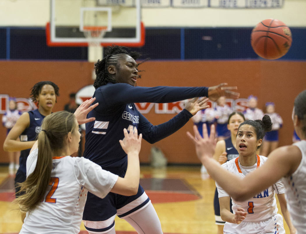 Centennial senior Eboni Walker (22) kicks the ball out to the corner past Bishop Gorman seni ...