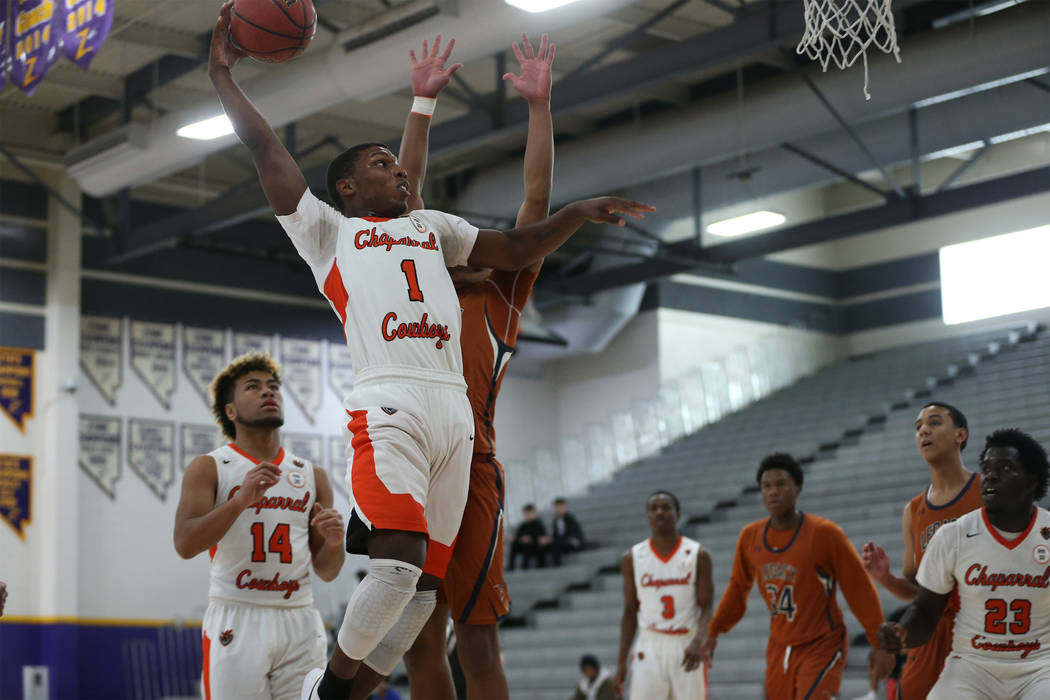 Chaparral’s Meshach Hawkins (1) goes up for a shot against Legacy in the boy’s b ...