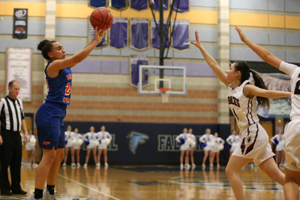 Bishop Gorman’s Bentleigh Hoskins (24) shoots a three-point-shot for a score against D ...