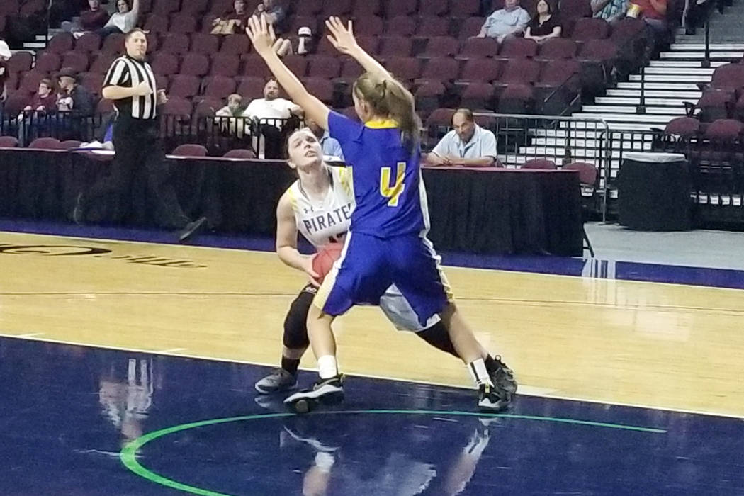 Moapa Valley’s Lainey Cornwell looks for a shot against Lowry’s Rebecca Kuskie i ...