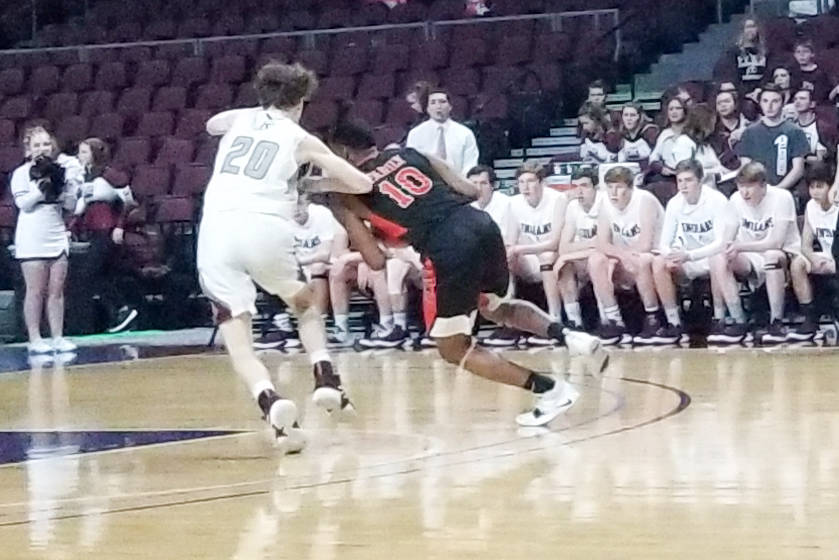 Chaparral’s Cairyn Bray drives past Elko’s Joseph Simpkins in the Class 3A state ...