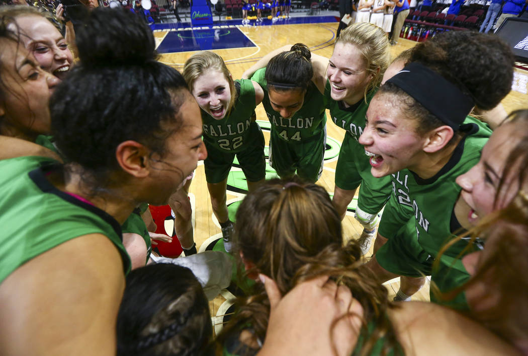 Churchill County players celebrate their win against Moapa Valley in the Class 3A girls bask ...