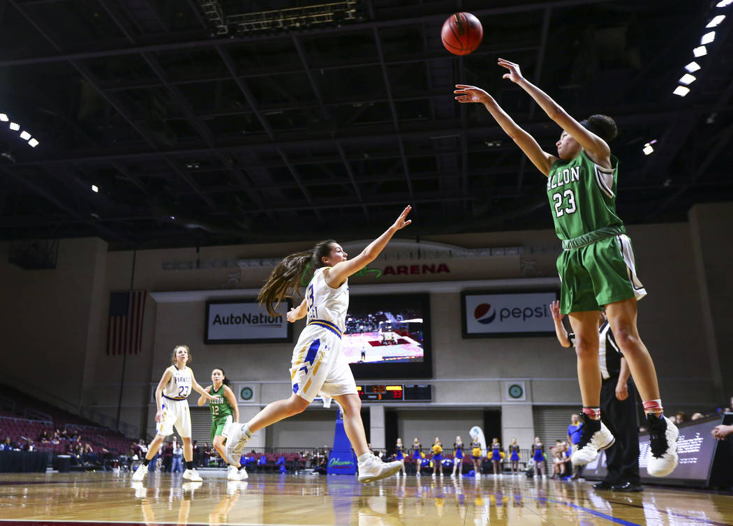 Churchill County’s Madison Whitaker (23) shoots over Moapa Valley’s Emilie Barra ...