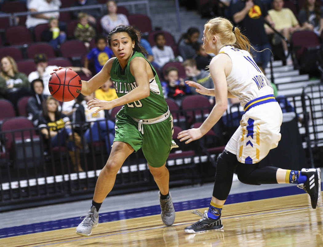 Churchill County’s Leilani Otuafi (20) moves the ball around Moapa Valley’s Kait ...