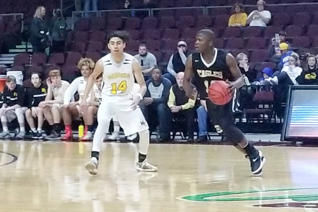 Spring Mountain’s Josiah Johnson, right, drives against Mineral County’s Antonio ...
