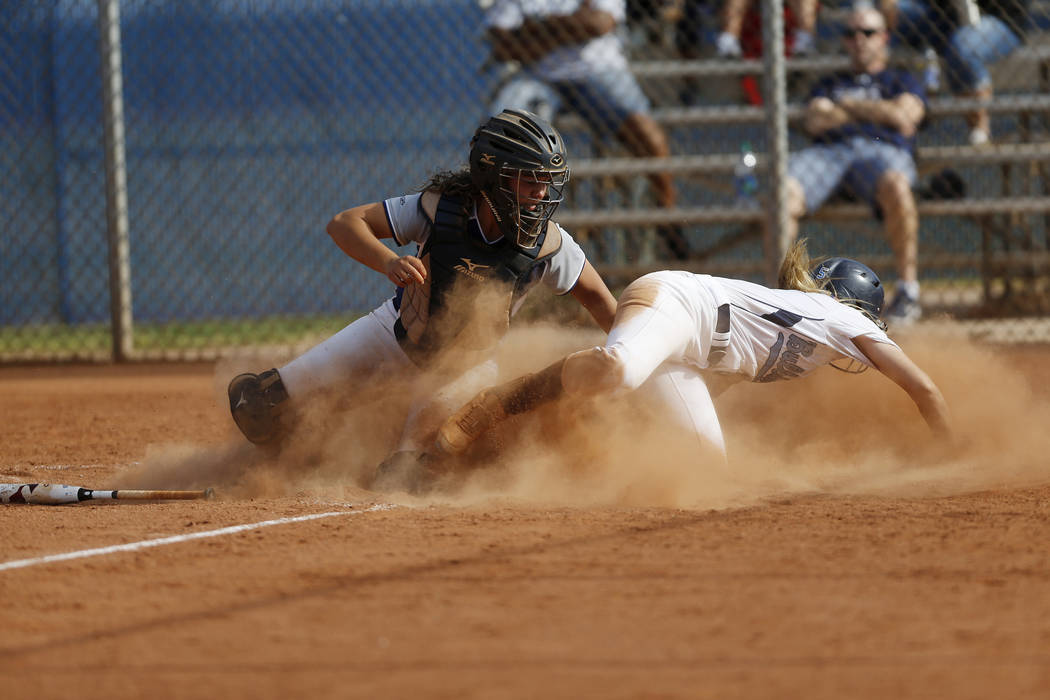 Shadow Ridge’s catcher Caitlyn Covington (3) tags Centennial’s Seanna Simpson (5 ...