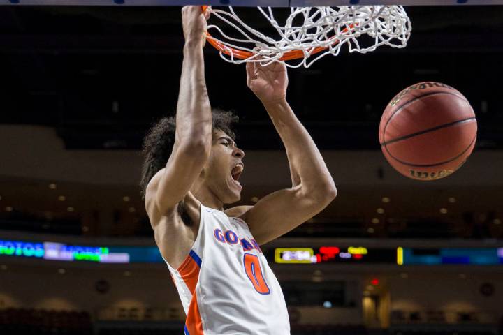 Bishop Gorman junior forward Isaiah Cottrell (0) converts a fast-break dunk in the fourth qu ...