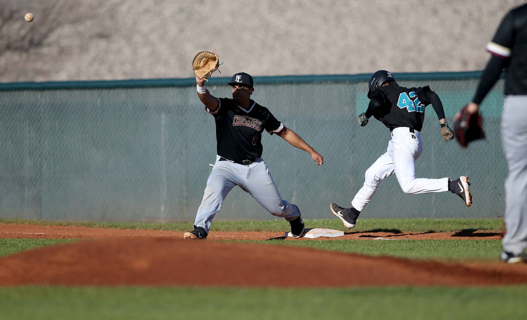 Silverado baserunner Caleb Hubbard (42) crosses first base as Faith Lutheran first baseman J ...