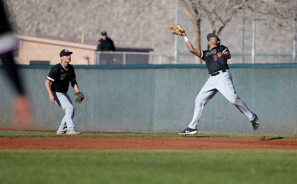 Faith Lutheran first baseman Jacob Ortega (8) catches a Silverado foul ball during a basebal ...