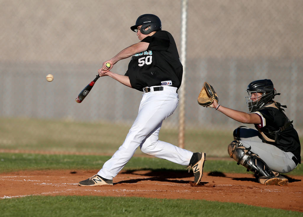 Silverado’s Russell Macias (50) swings at a pitch as Carson Bonus catches during a bas ...